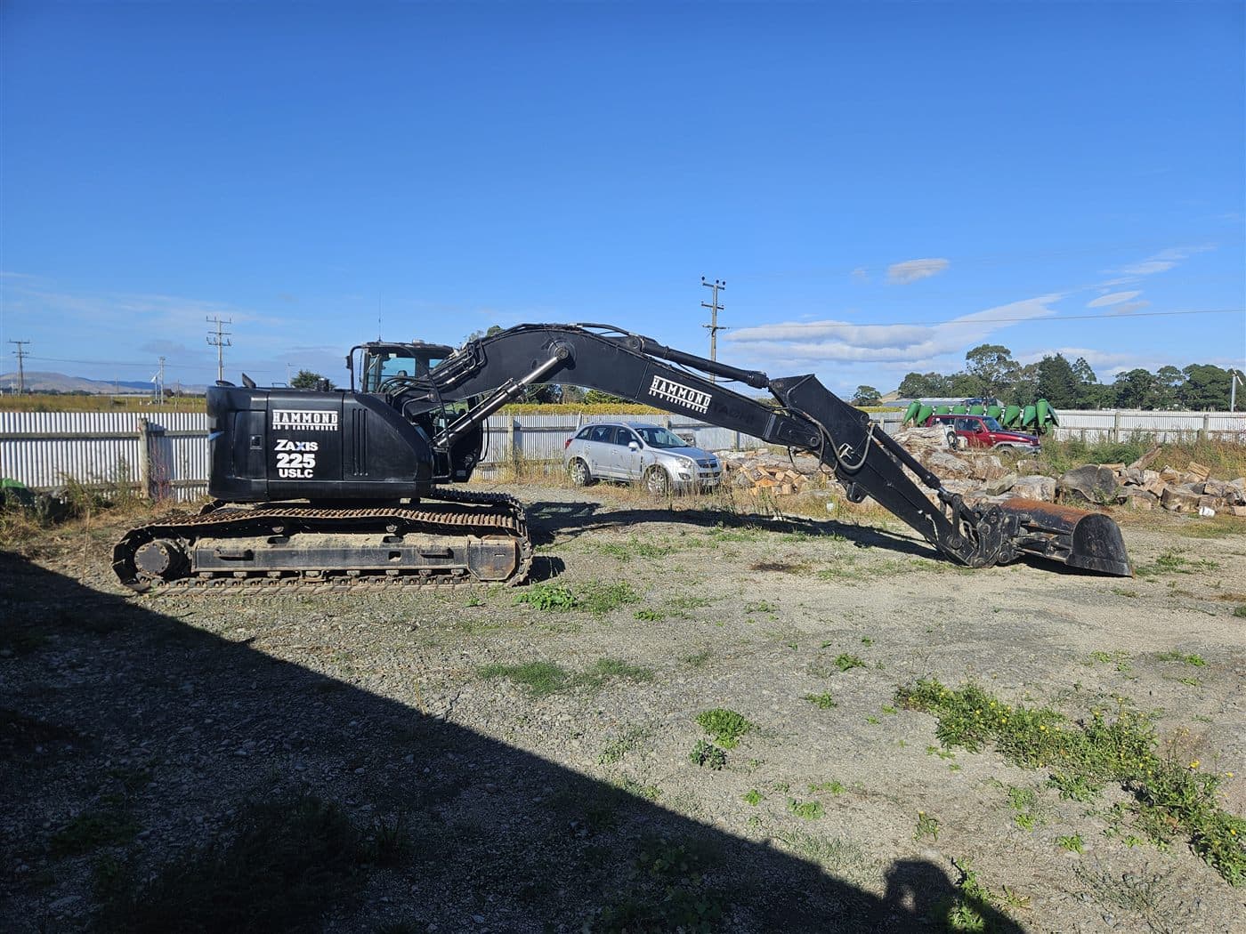 Hitachi ZAXIS 225 tracked excavator parked in a Hawke’s Bay yard